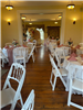 Tables with white linens and pink accents