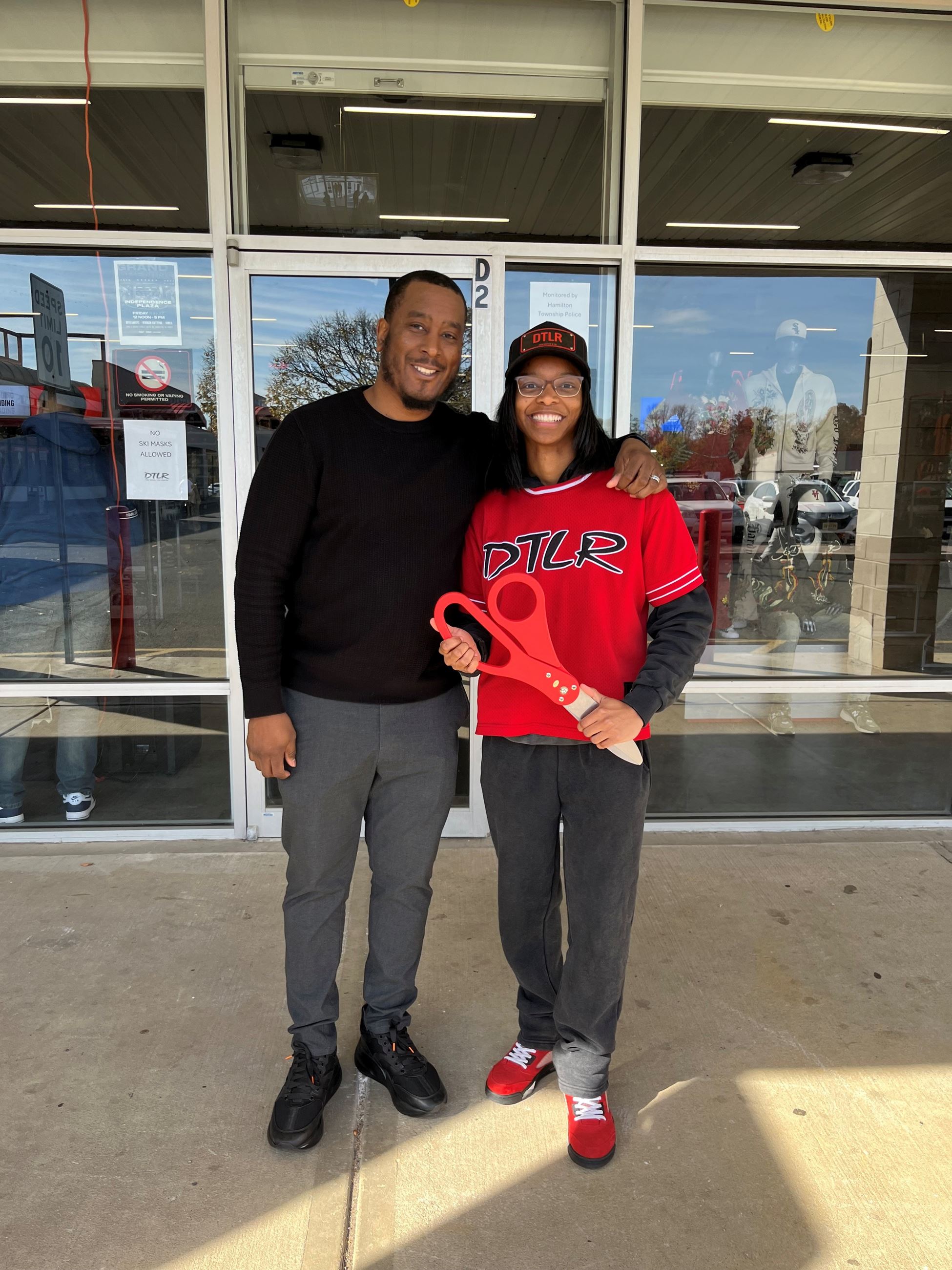 Group Photo at DTLR Grand opening ribbon cutting with managers
