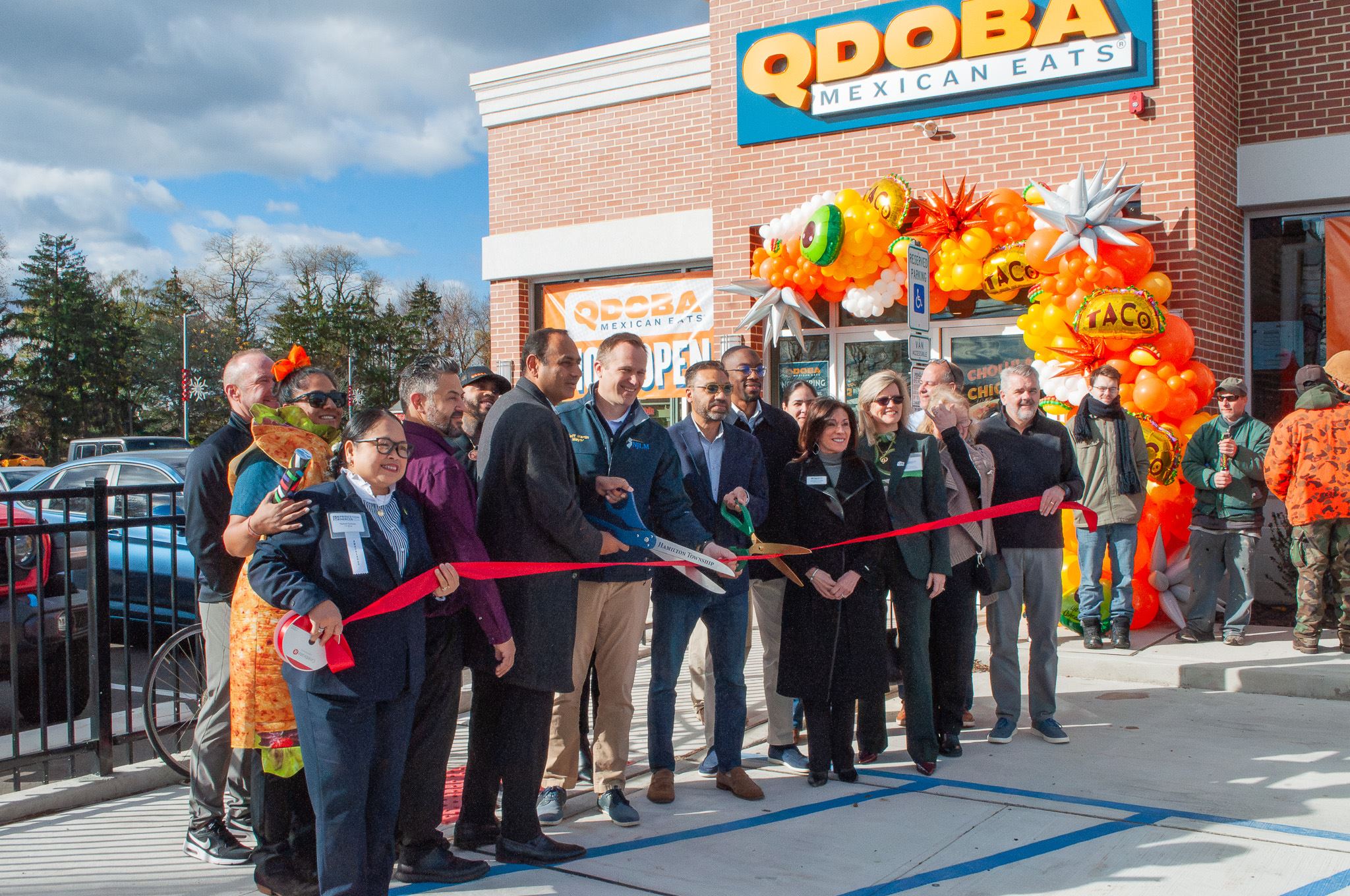 Qdoba Group photo with mayor martin at grand opening event